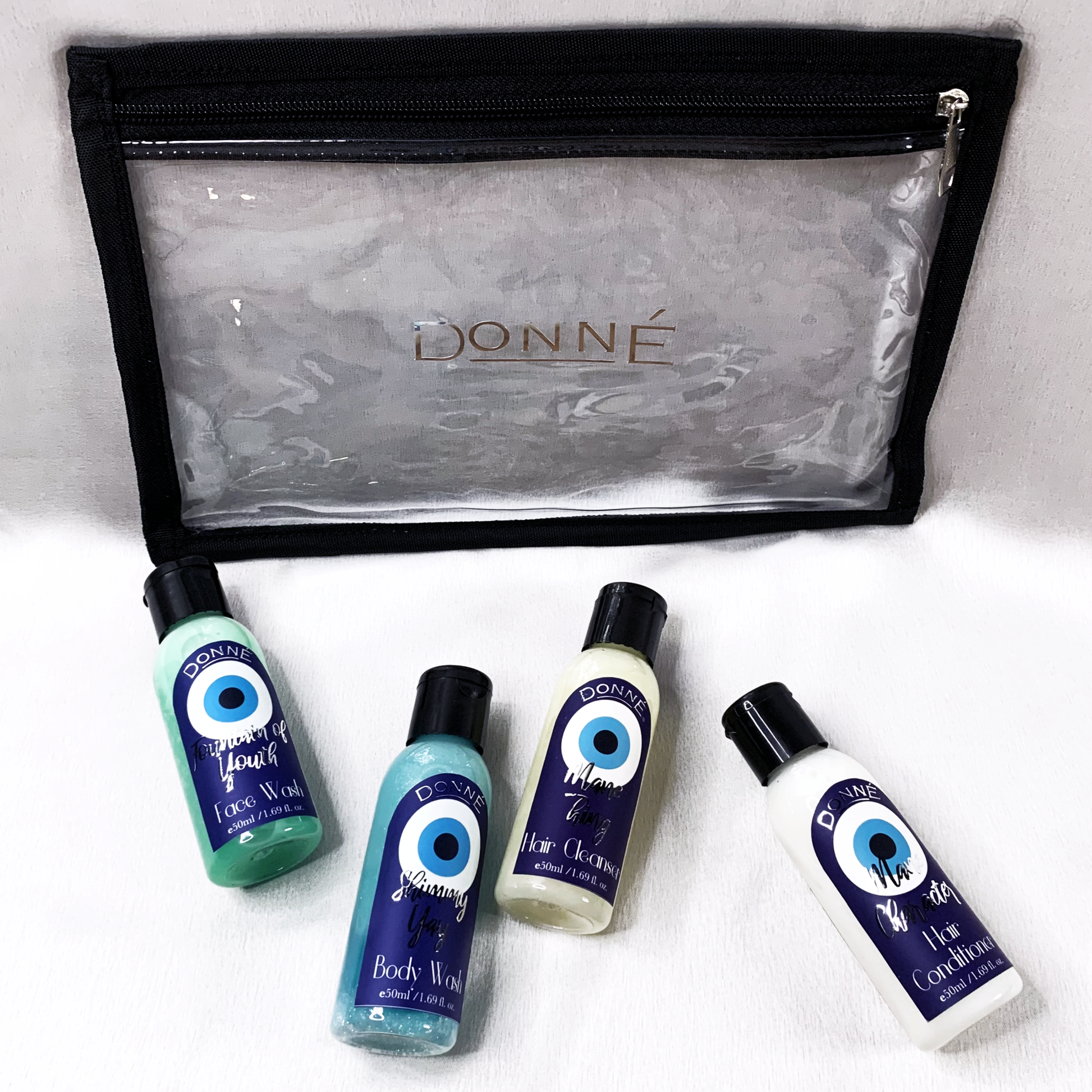 Bare Essentials Travel Kit with a face wash, body wash, shampoo and conditioner