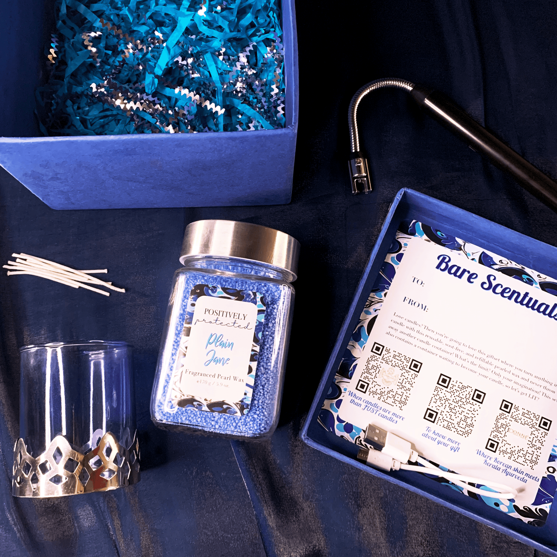 Bare Scentuals Candle Gift Set Product Layout with blue pearl wax in a glass jar and a glass container and electric lighter