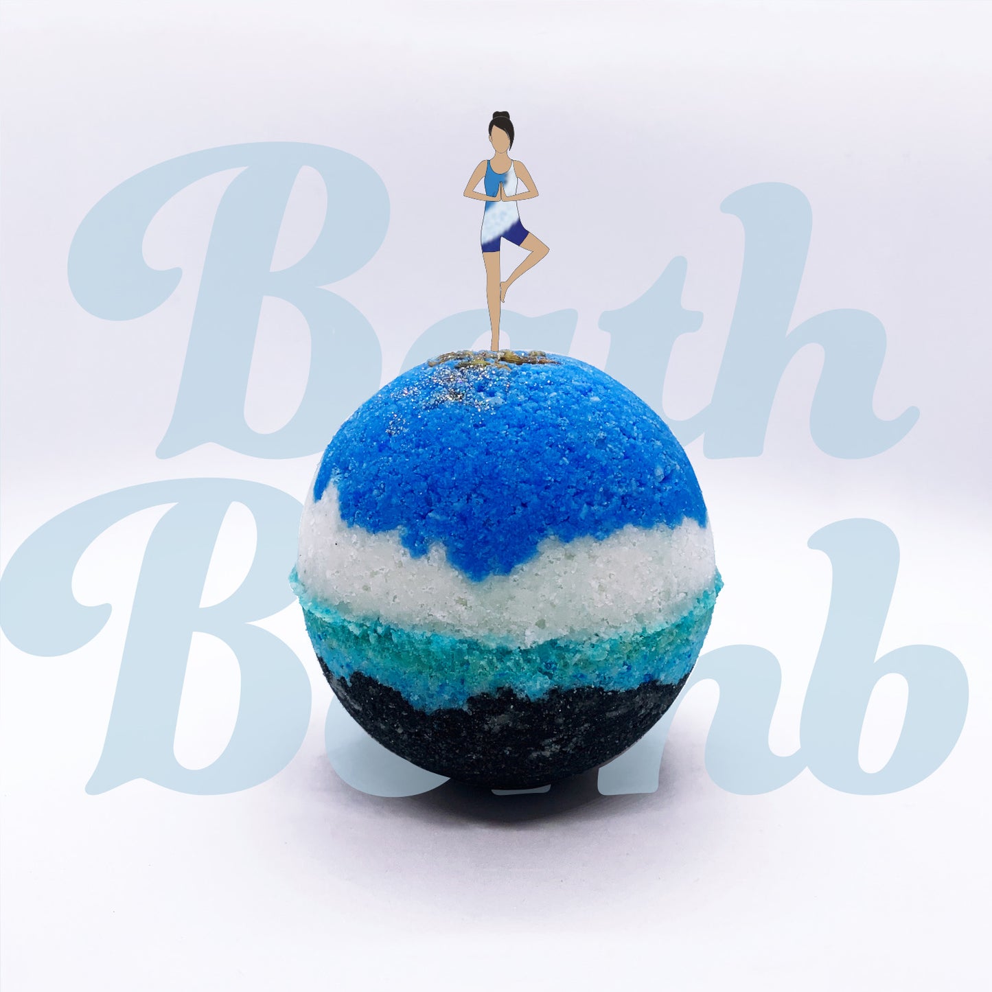 Multilayered Epsom salt and baking soda based fizzy bath bomb in blue, white, turquoise and black and lavender buds on top with an illustrated woman doing yoga on the peak